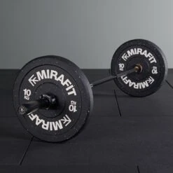 Mirafit M3 Women's 15kg Olympic Barbell - Black -Fitness Promotion Store Black Mirafit 15kg M3 Barbell and weights sat on gym mats