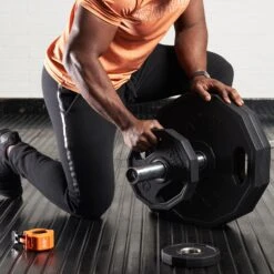 Mirafit Hex Olympic Weight Plates -Fitness Promotion Store Loading Mirafit Hex Olympic Weight Plates onto Barbell 1