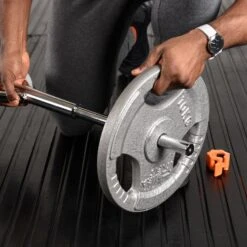 Mirafit Standard Swiss Bar -Fitness Promotion Store Loading Weight Plates on Mirafit Multi Grip Standard Swiss Bar