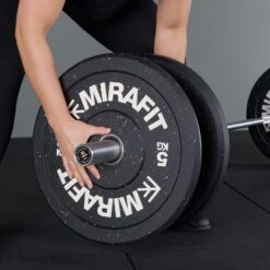 Mirafit M3 Women's 15kg Olympic Barbell -Fitness Promotion Store Loading weights on Mirafit 15kg M3 Barbell