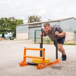 Mirafit M3 Weight Sled Double Lower Handle Attachment 15 Mirafit M3 Weight Sled Double Lower Handle Attachment -Fitness Promotion Store Luke Richardson Pushing Mirafit M3 Sled with Bumper Plates