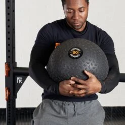 Mirafit Strongman Training Ball -Fitness Promotion Store Man Holding Mirafit 50kg Strongman Training Ball