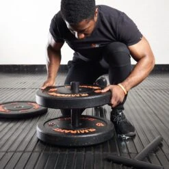 Mirafit Olympic Plate Loading Pin T Handle -Fitness Promotion Store Man Loading Plates onto a Mirafit Loading Pin Power Handle