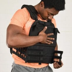Mirafit Tactical Weight Vest 19 Mirafit Tactical Weight Vest -Fitness Promotion Store Man Securing a Mirafit Black Tactical Weight Vest
