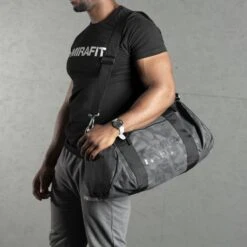 Mirafit Camo Gym Duffle Bag -Fitness Promotion Store Man Walking with a Mirafit Camo Gym Duffle Bag