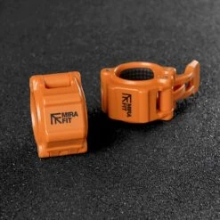 Mirafit Gen II 2" Olympic Weight Bar Quick Release Collars -Fitness Promotion Store Mirafit Gen III QR Collar Orange on gym mats 1