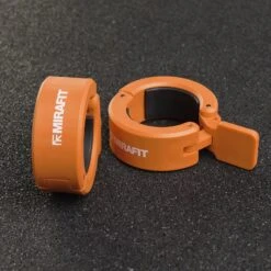 Mirafit Olympic Dumbbell Collars -Fitness Promotion Store Mirafit Orange Olympic Dumbbell Collars on gym mats