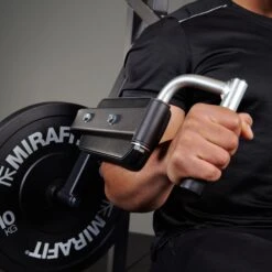 Mirafit Lateral Raise And Shoulder Press Machine -Fitness Promotion Store holding handles Mirafit Deltoid and Shoulder Press Machine