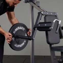 Mirafit Lateral Raise And Shoulder Press Machine -Fitness Promotion Store loading plates on Mirafit Deltoid and Shoulder Press Machine