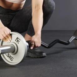 Mirafit M3 Olympic EZ Curl Bar -Fitness Promotion Store loading plates on Mirafit M3 EZ Curl Bar