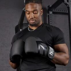 Mirafit Leather Boxing Gloves -Fitness Promotion Store man wearing Mirafit Leather Boxing Gloves