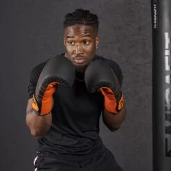 Mirafit PU Boxing Gloves -Fitness Promotion Store man wearing Mirafit PU Boxing Gloves