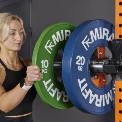 Mirafit Competition Olympic Bumper Plates -Fitness Promotion Store mirafit competition bumper plates loading onto rack