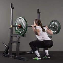 Mirafit M250 Adjustable Weight Bench & M230 Squat Rack Kit -Fitness Promotion Store squatting in a Mirafit M250 Weight Bench Squat Rack Kit 1