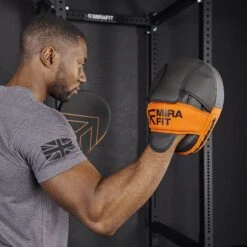 Mirafit PU Boxing Mitts -Fitness Promotion Store wearing a Mirafit PU Boxing Mitt