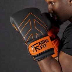 Mirafit PU Boxing Gloves -Fitness Promotion Store wearing pair of Mirafit PU Boxing Gloves