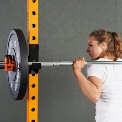 Mirafit M220 Squat Rack -Fitness Promotion Store woman racking a Barbell on a Mirafit M220 Squat Rack